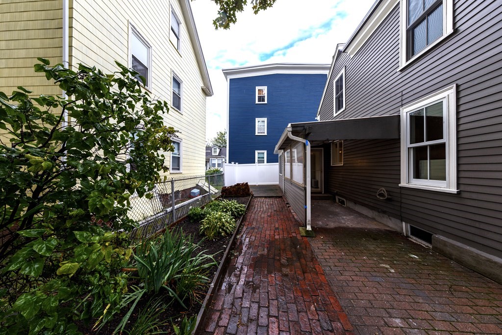 7 Herbert Street Salem, MA 01970 - Photo 17 of 17 a house with trees in front of it