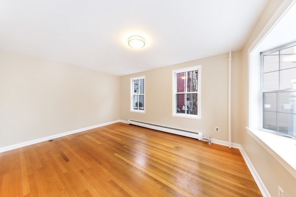 7 Herbert Street Salem, MA 01970 - Photo 6 of 17 a view of an empty room with a window