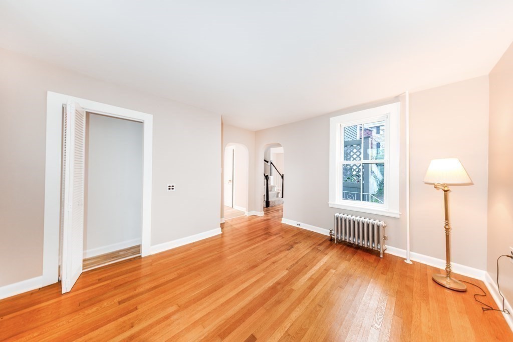 7 Herbert Street Salem, MA 01970 - Photo 8 of 17 a bedroom with a bed and a window