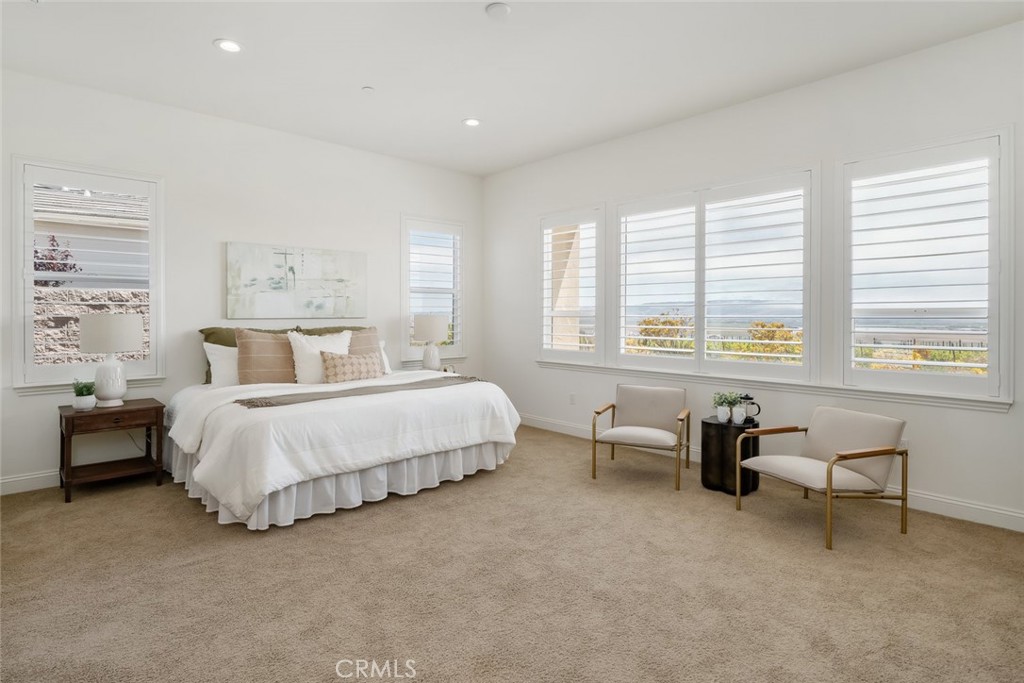 1622 Eucalyptus Road Nipomo, CA 93444 - Photo 24 of 73 a bed room with a bed and a chair