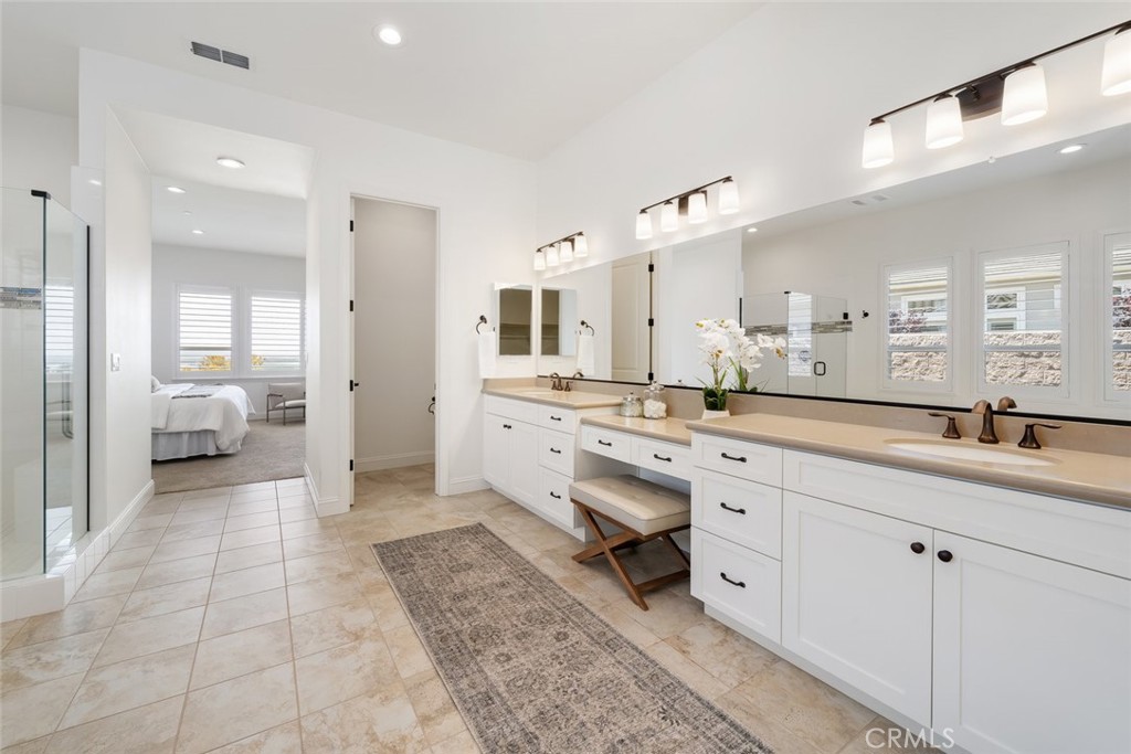 1622 Eucalyptus Road Nipomo, CA 93444 - Photo 30 of 73 a bathroom with a sink a mirror and a shower