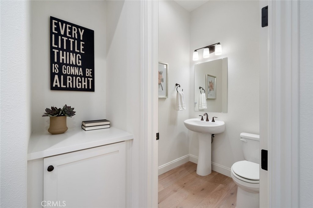 1622 Eucalyptus Road Nipomo, CA 93444 - Photo 38 of 73 a bathroom with a sink toilet and a mirror