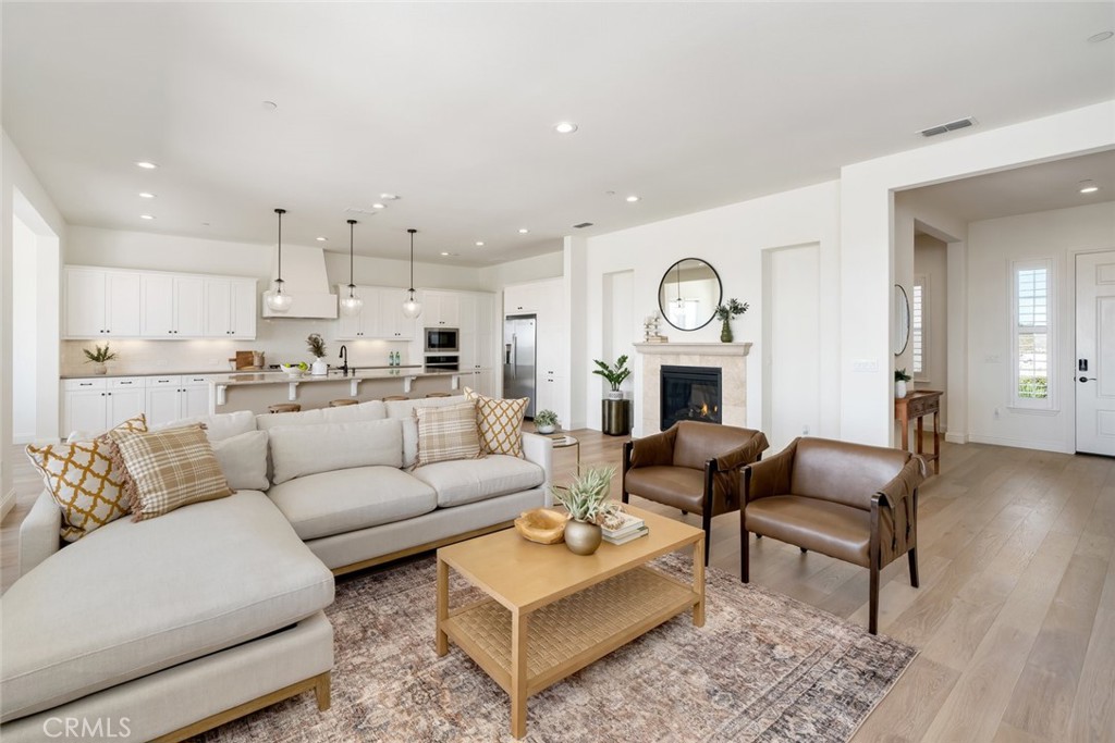 1622 Eucalyptus Road Nipomo, CA 93444 - Photo 4 of 73 a living room with furniture and a fireplace