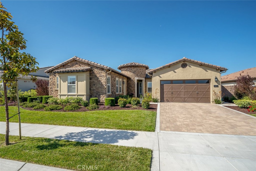1622 Eucalyptus Road Nipomo, CA 93444 - Photo 41 of 73 a view of a house with a yard and potted plants