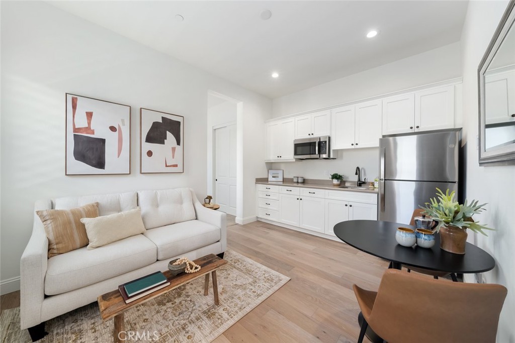 1622 Eucalyptus Road Nipomo, CA 93444 - Photo 45 of 73 a living room with stainless steel appliances furniture and a refrigerator