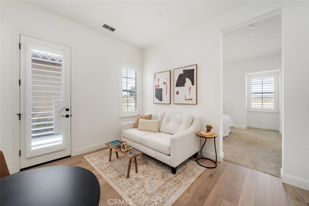 1622 Eucalyptus Road Nipomo, CA 93444 - Photo 48 of 73 a living room with furniture and wooden floor