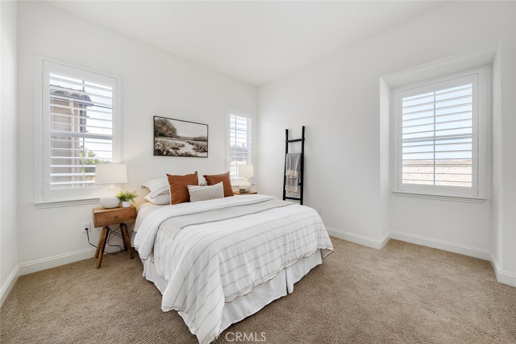 1622 Eucalyptus Road Nipomo, CA 93444 - Photo 49 of 73 a bedroom with a bed and a window