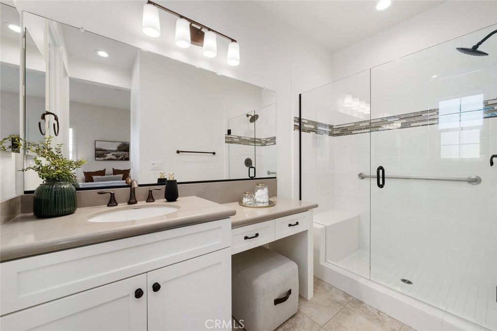 1622 Eucalyptus Road Nipomo, CA 93444 - Photo 52 of 73 a bathroom with a double vanity sink a mirror and shower