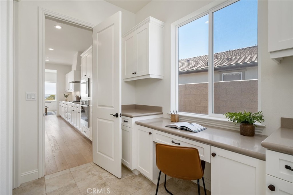1622 Eucalyptus Road Nipomo, CA 93444 - Photo 55 of 73 a kitchen that has a lot of cabinets in it with stainless steel appliances granite countertop a stove a sink and a refrigerator