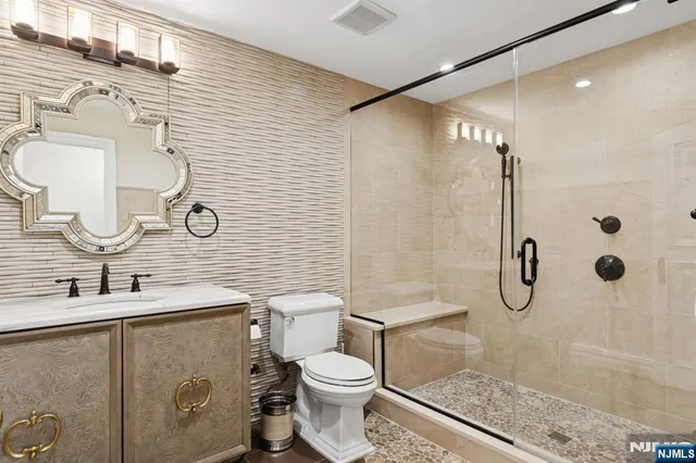 a bathroom with a toilet sink and shower