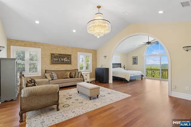a spacious bathroom with a shower sink and mirror