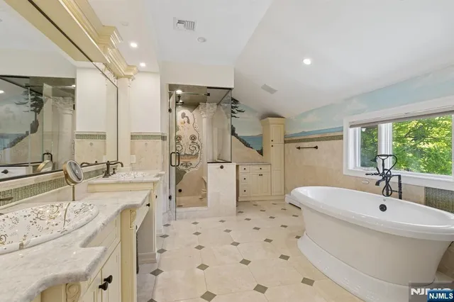 a bathroom with a granite countertop sink toilet a mirror and shower