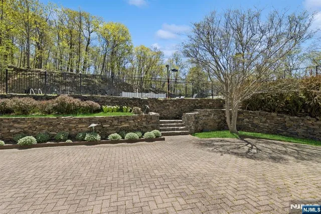 a view of a building with sitting area and roof deck