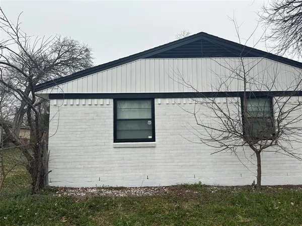 a front view of a house with yard