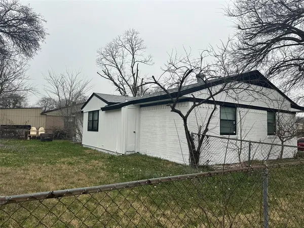 a house that has tree in front of it