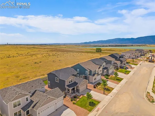 an aerial view of residential building and ocean