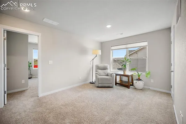 a bed room with a bed and a window