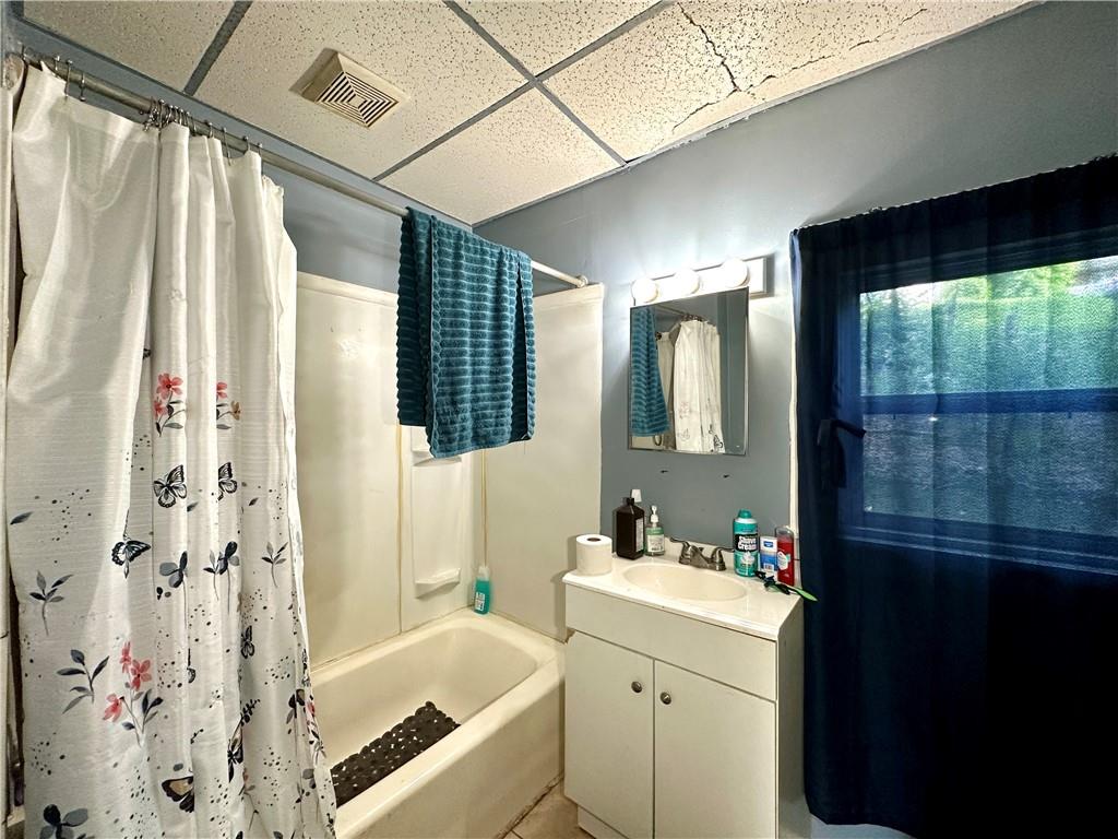 114 South Street Butler, PA 16001 - Photo 15 of 32 a bathroom with a tub sink and mirror