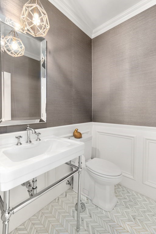 178 Lowell Road Wellesley, MA 02481 - Photo 17 of 38 a bathroom with a sink a toilet a mirror and vanity