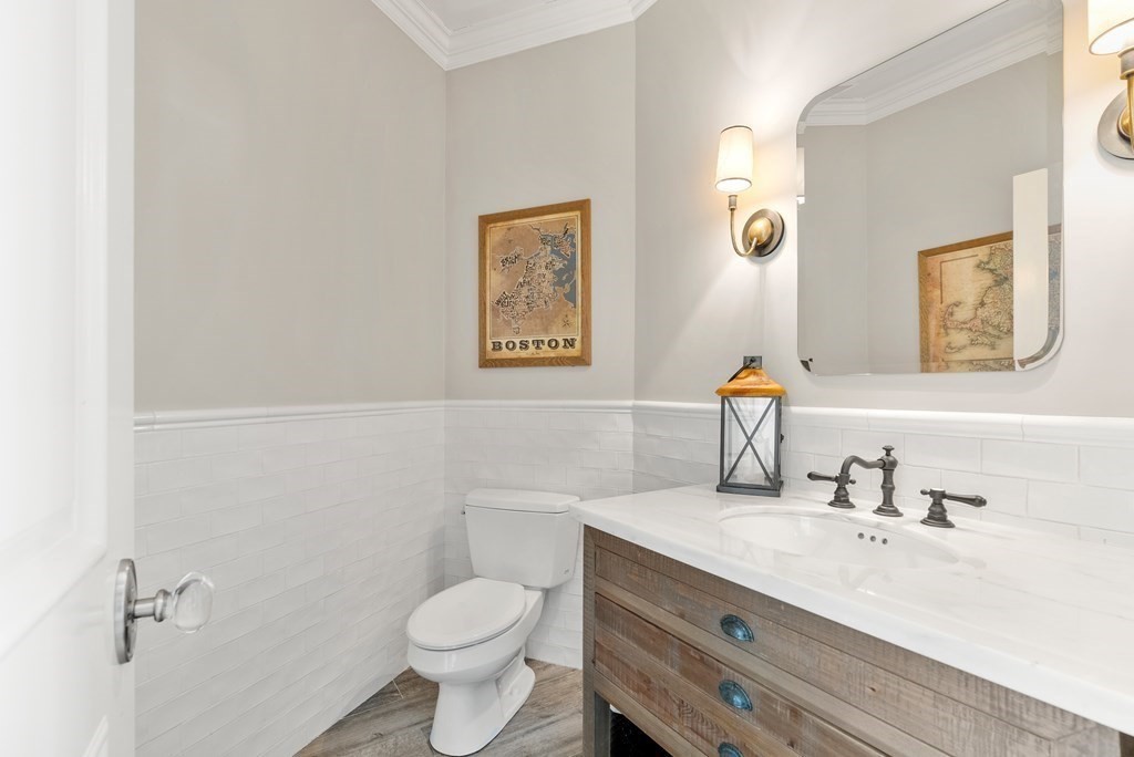 178 Lowell Road Wellesley, MA 02481 - Photo 18 of 38 a bathroom with a sink mirror vanity and toilet