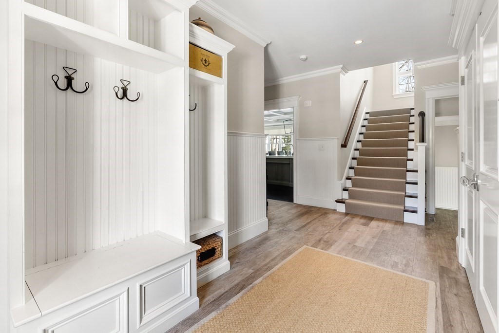 178 Lowell Road Wellesley, MA 02481 - Photo 19 of 38 a view of a hallway with entryway and wooden floor