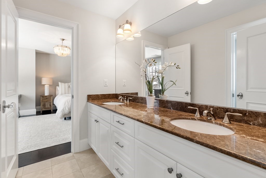 178 Lowell Road Wellesley, MA 02481 - Photo 26 of 38 a bathroom with a granite countertop double vanity sink and a mirror