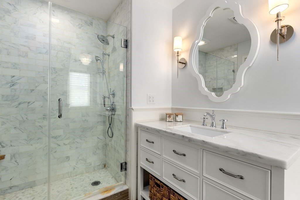 178 Lowell Road Wellesley, MA 02481 - Photo 29 of 38 a bathroom with a double vanity sink mirror and shower