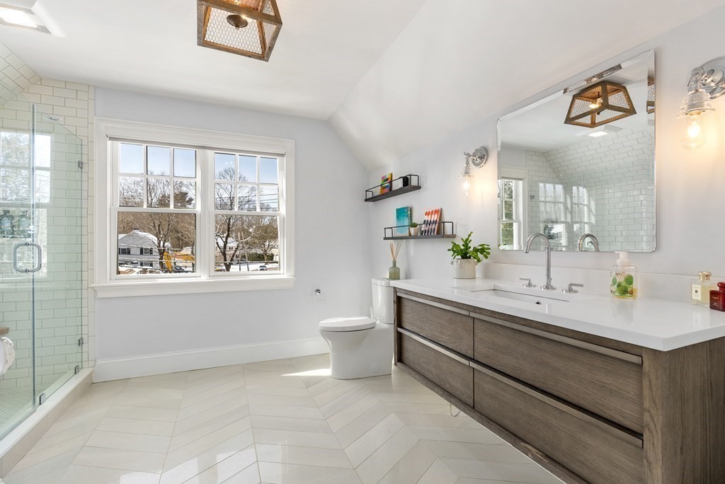 178 Lowell Road Wellesley, MA 02481 - Photo 31 of 38 a bathroom with a double vanity sink toilet and a mirror