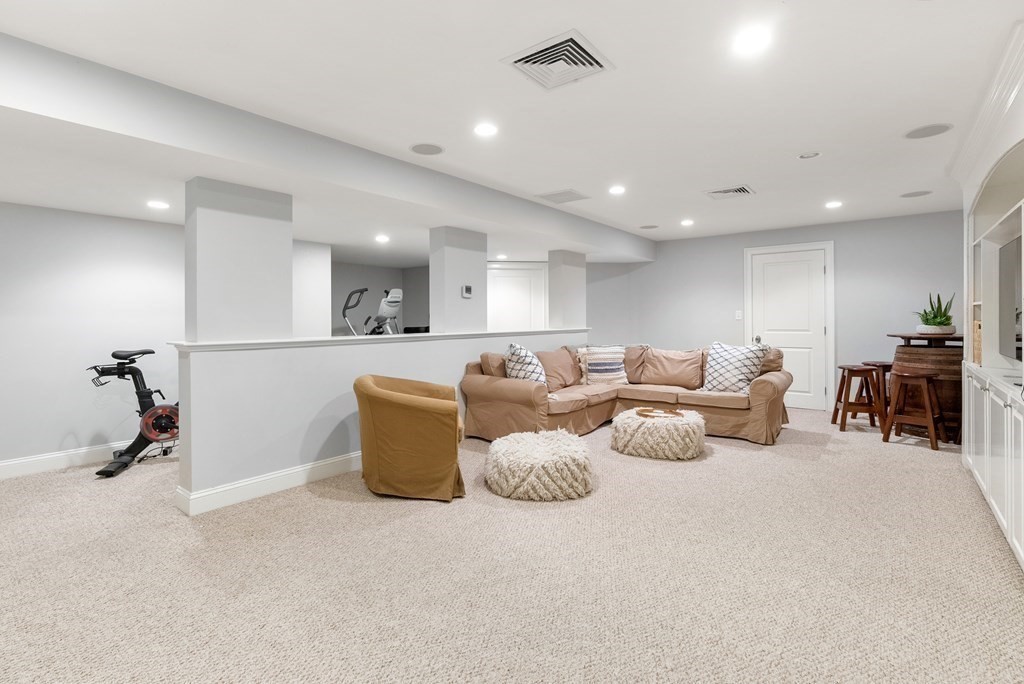 178 Lowell Road Wellesley, MA 02481 - Photo 33 of 38 a living room with furniture white air and white walls