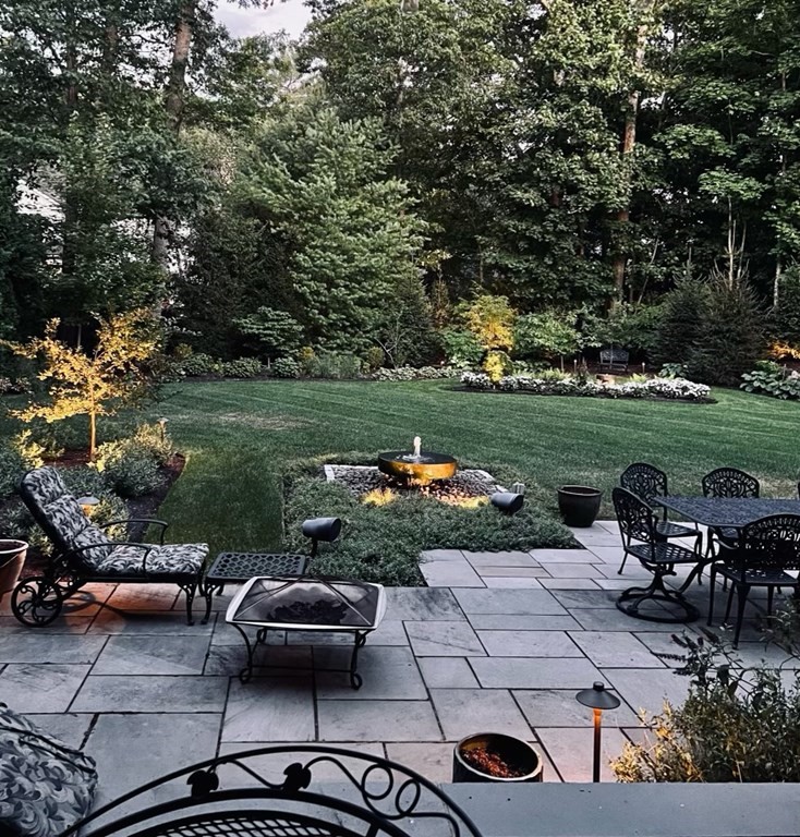 178 Lowell Road Wellesley, MA 02481 - Photo 38 of 38 a view of a patio with chair and tables