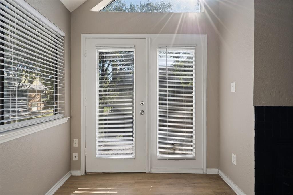 9831 Walnut Street, Unit 205 Dallas, TX 75243 - Photo 7 of 29 Doorway to outside with a wealth of natural light and light wood-type flooring
