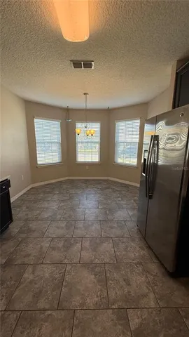 a view of empty room with windows