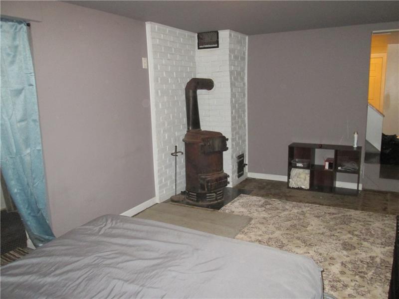389 Freeport Road Butler, PA 16002 - Photo 22 of 25 woodburner in lower level area