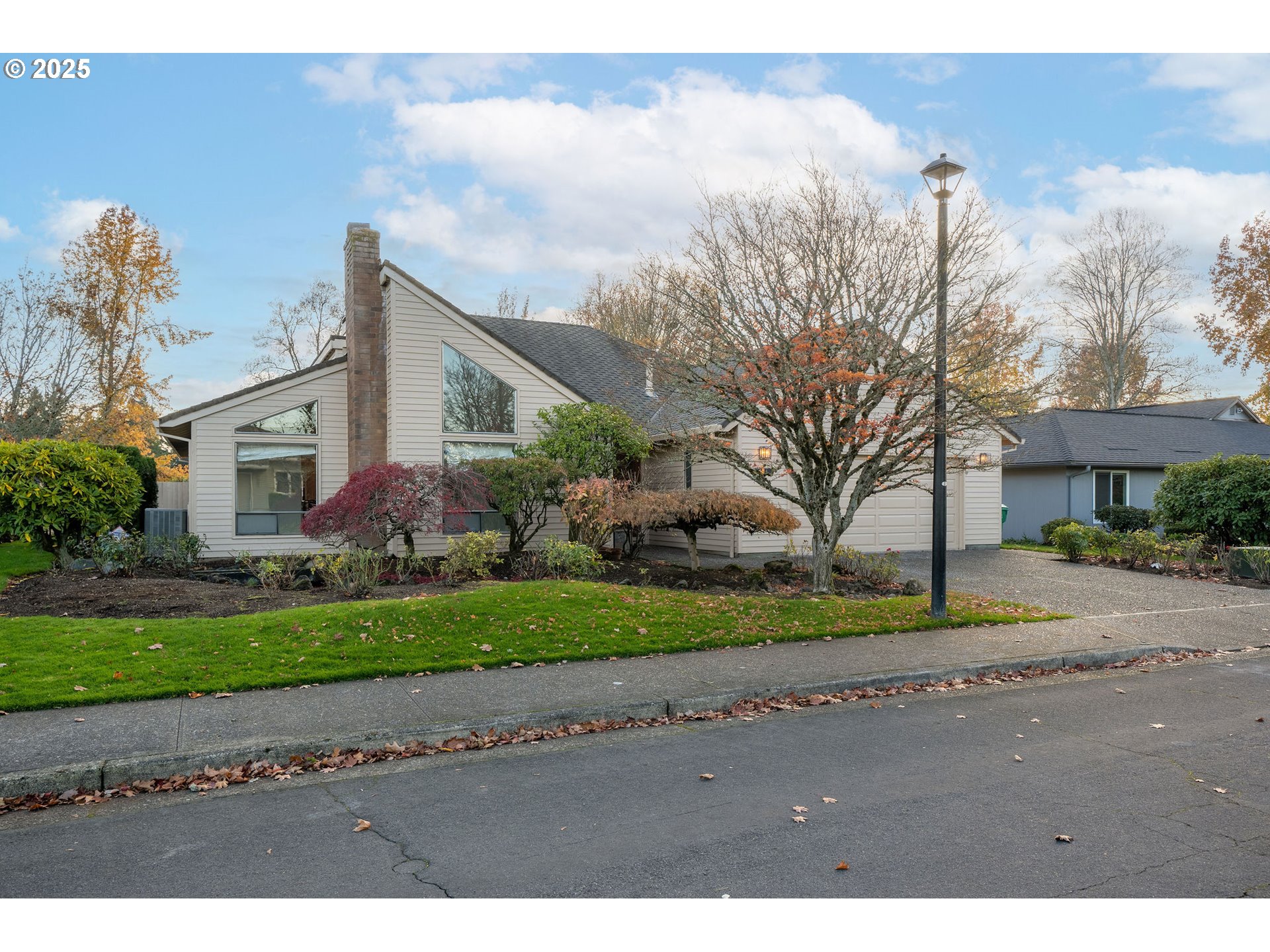 7104 Southwest Chapel Lane Portland, OR 97223 - Photo 1 of 36 a front view of a house with a yard and garage