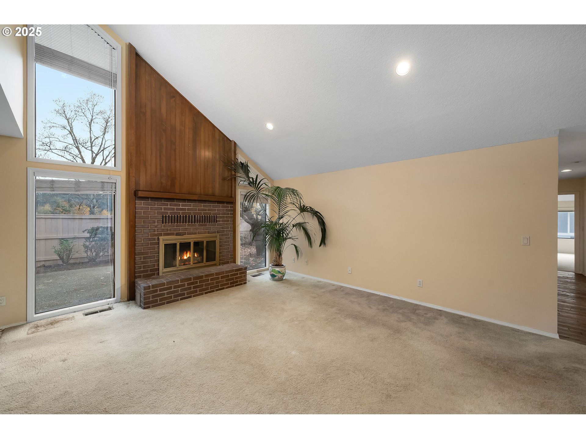 7104 Southwest Chapel Lane Portland, OR 97223 - Photo 14 of 36 a view of an empty room with a fireplace