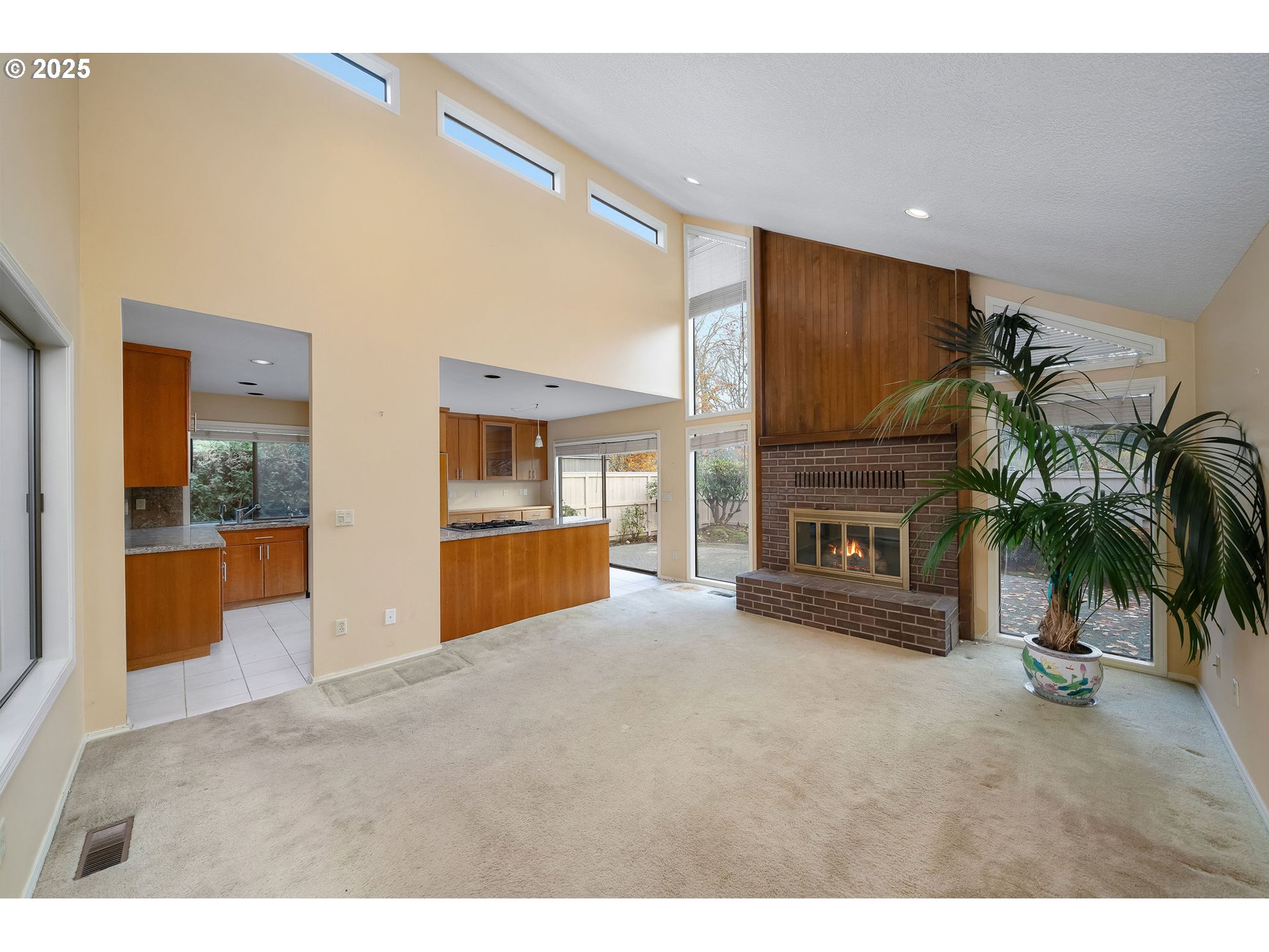 7104 Southwest Chapel Lane Portland, OR 97223 - Photo 15 of 36 a view of an empty room with a fireplace