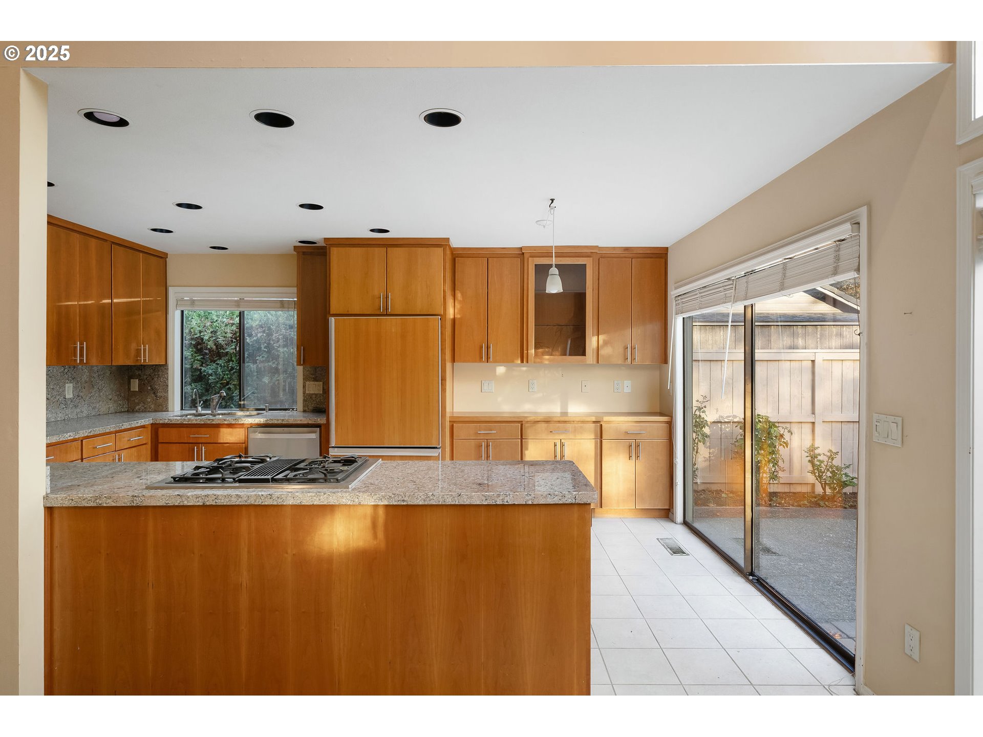 7104 Southwest Chapel Lane Portland, OR 97223 - Photo 17 of 36 a view of kitchen with granite countertop cabinets and window
