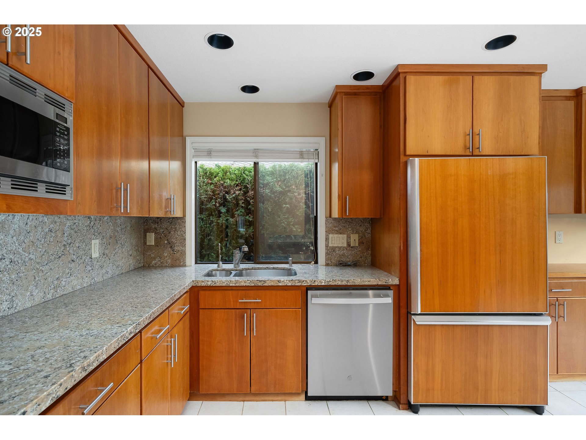 7104 Southwest Chapel Lane Portland, OR 97223 - Photo 19 of 36 a kitchen with a refrigerator and a sink