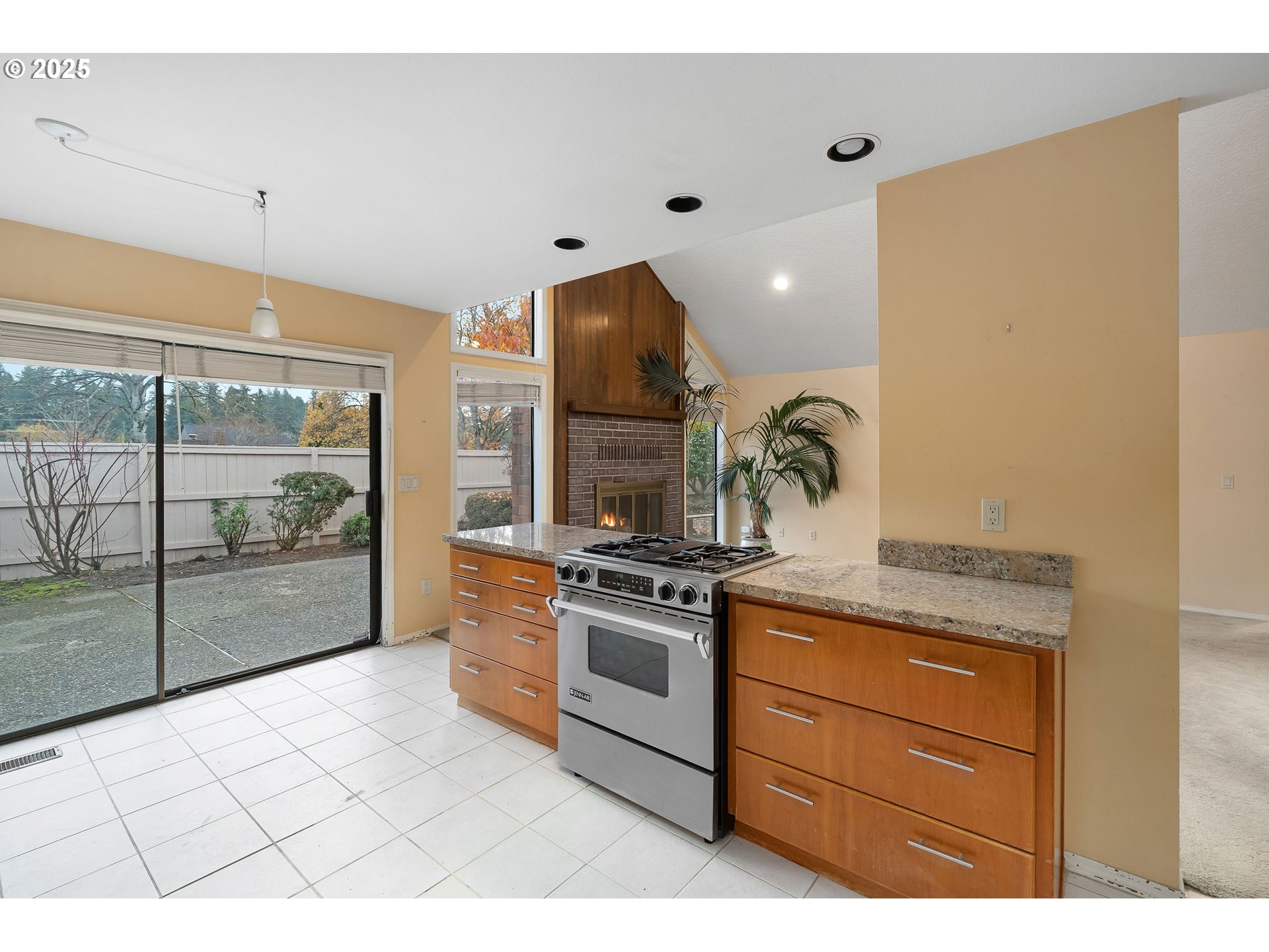 7104 Southwest Chapel Lane Portland, OR 97223 - Photo 21 of 36 a kitchen with stainless steel appliances granite countertop a stove a sink and a refrigerator