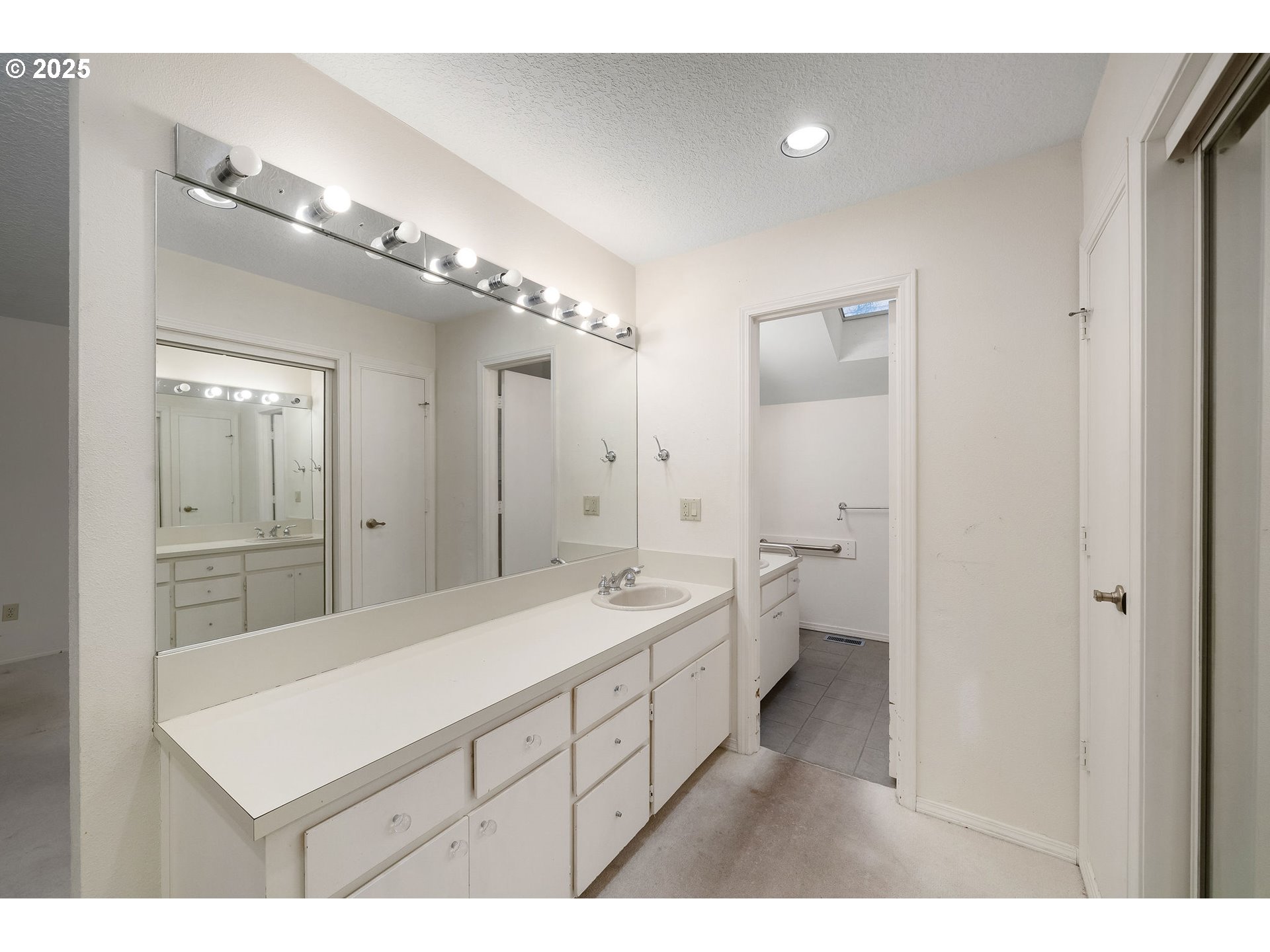 7104 Southwest Chapel Lane Portland, OR 97223 - Photo 23 of 36 a bathroom with a sink a toilet and shower