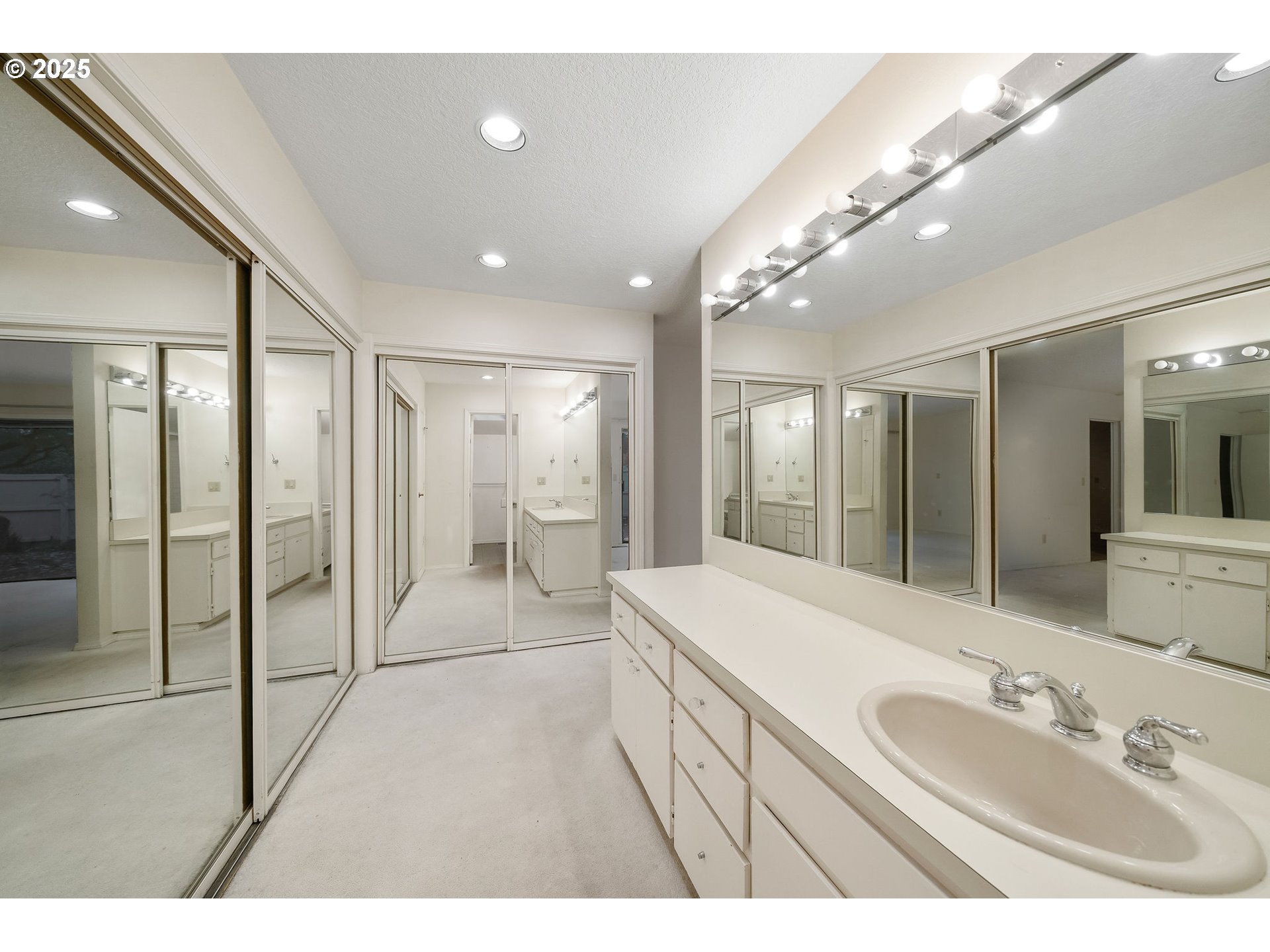 7104 Southwest Chapel Lane Portland, OR 97223 - Photo 26 of 36 a bathroom with a sink a large mirror and shower