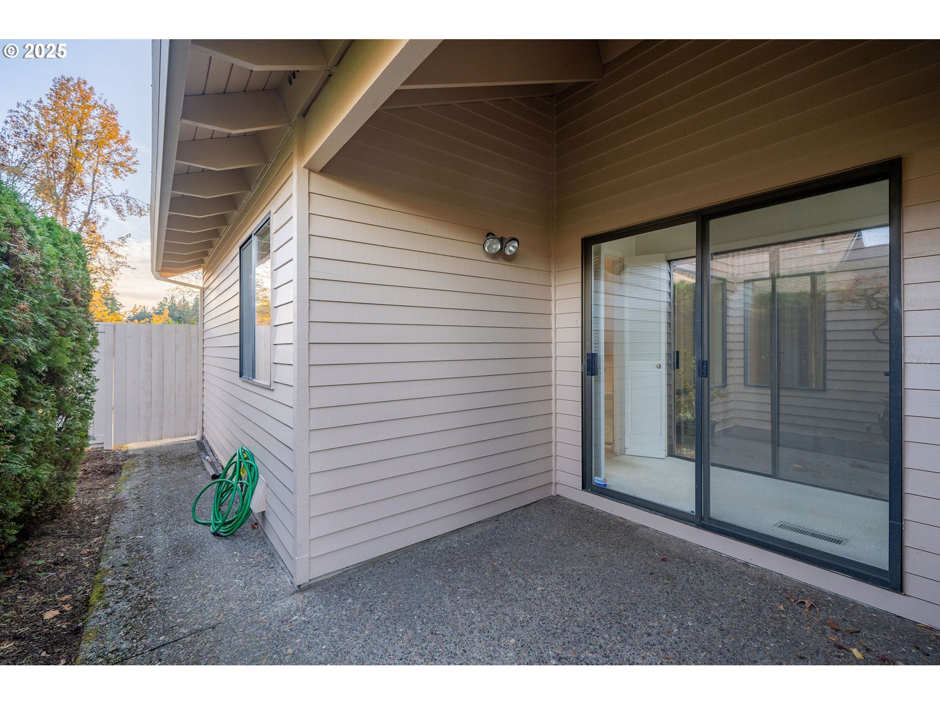 7104 Southwest Chapel Lane Portland, OR 97223 - Photo 27 of 36 a backyard of a house with potted plants