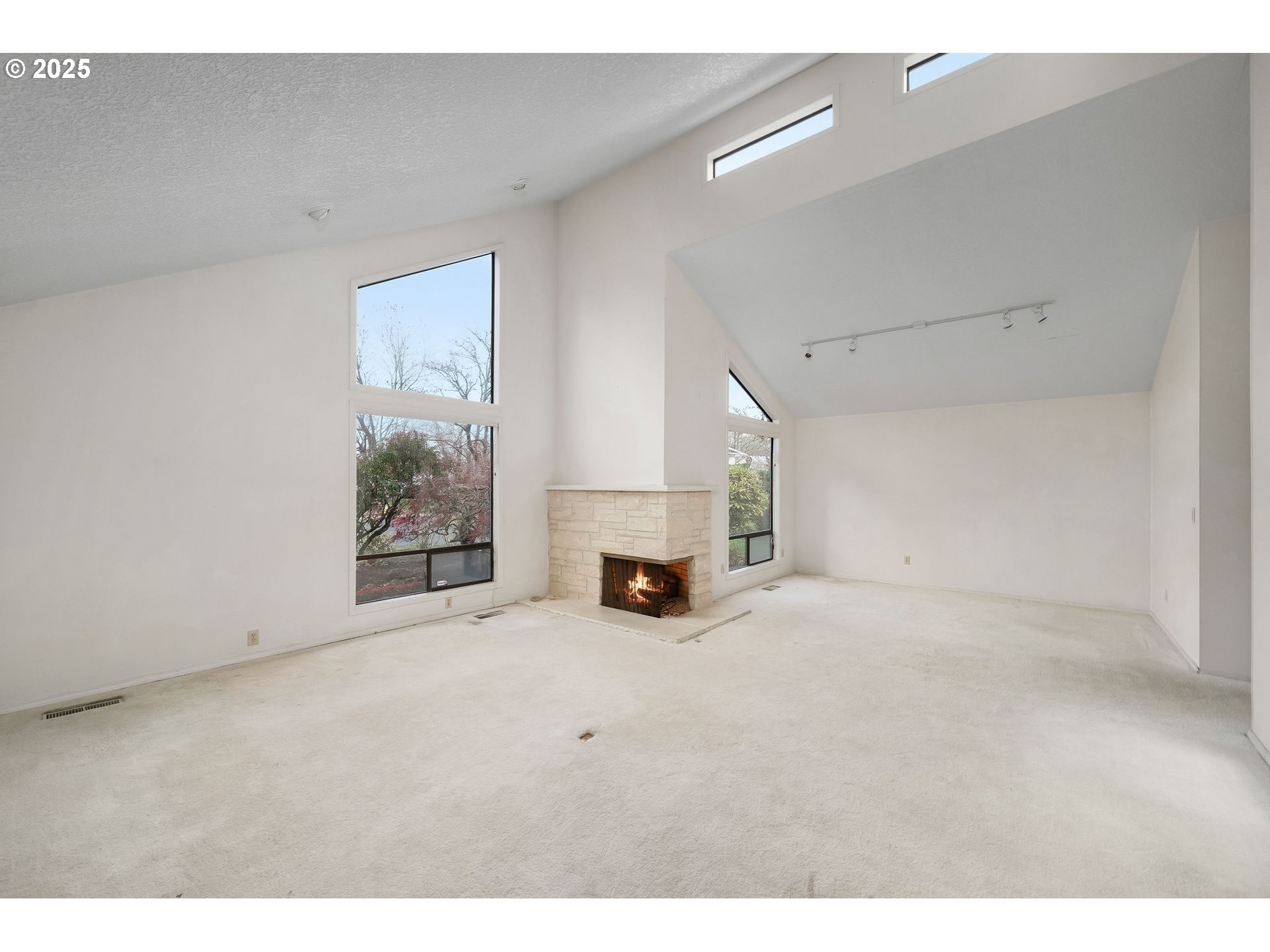 7104 Southwest Chapel Lane Portland, OR 97223 - Photo 8 of 36 a view of empty room with furniture and a fireplace