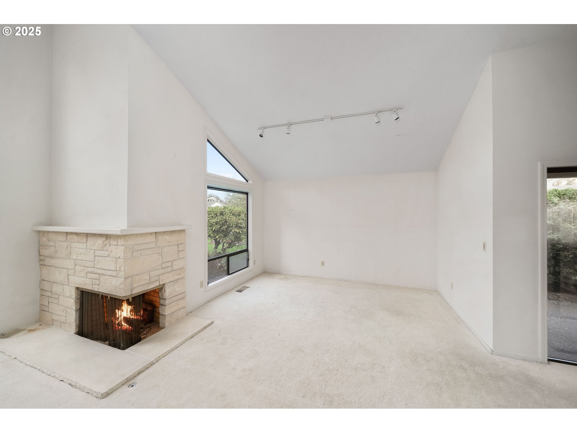 7104 Southwest Chapel Lane Portland, OR 97223 - Photo 9 of 36 a living room with furniture and a fireplace