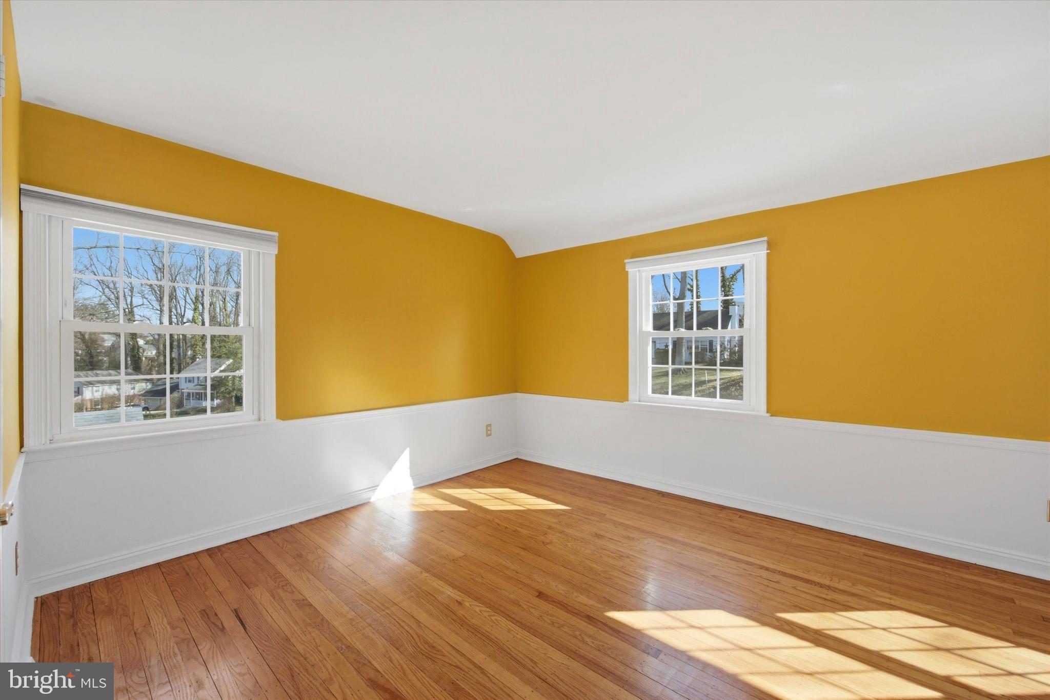 436 Kerr Lane Springfield, PA 19064 - Photo 26 of 52 a view of an empty room with wooden floor and a window
