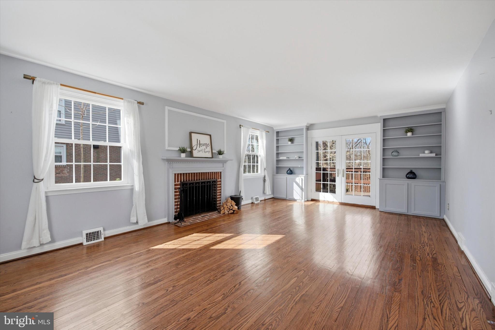 436 Kerr Lane Springfield, PA 19064 - Photo 6 of 52 a view of an empty room with wooden floor and a window