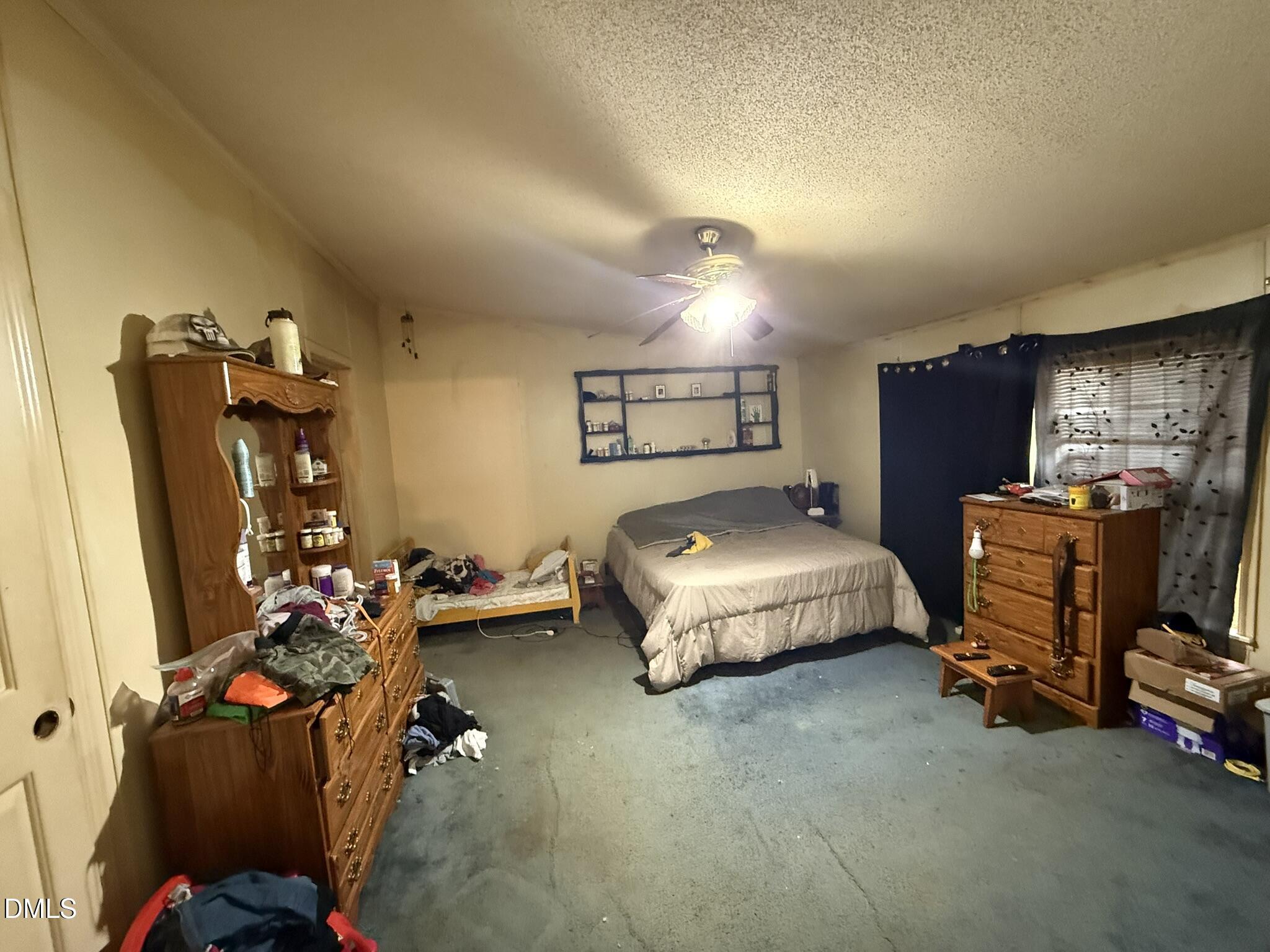 4749 Buckhorn Road Sanford, NC 27330 - Photo 7 of 18 a bedroom with bed and a tv