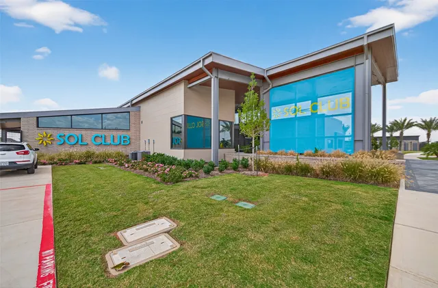 a front view of house with yard and outdoor seating