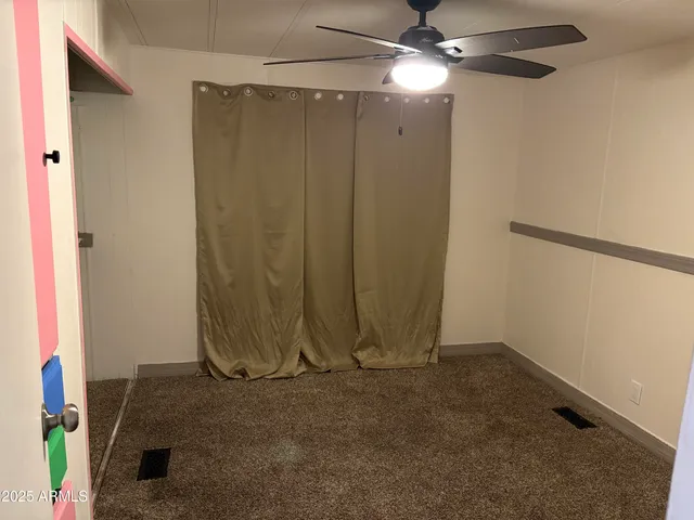 en empty room with a flat screen tv