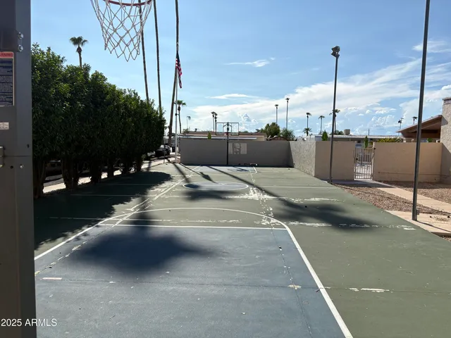 a view of a gallery with wooden floor